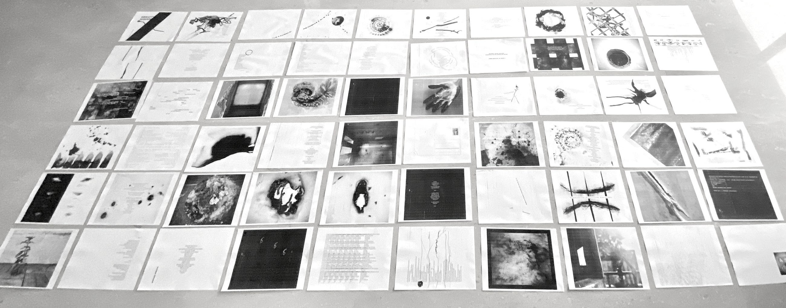 The whole book laid out page by page across a studio floor in six long rows